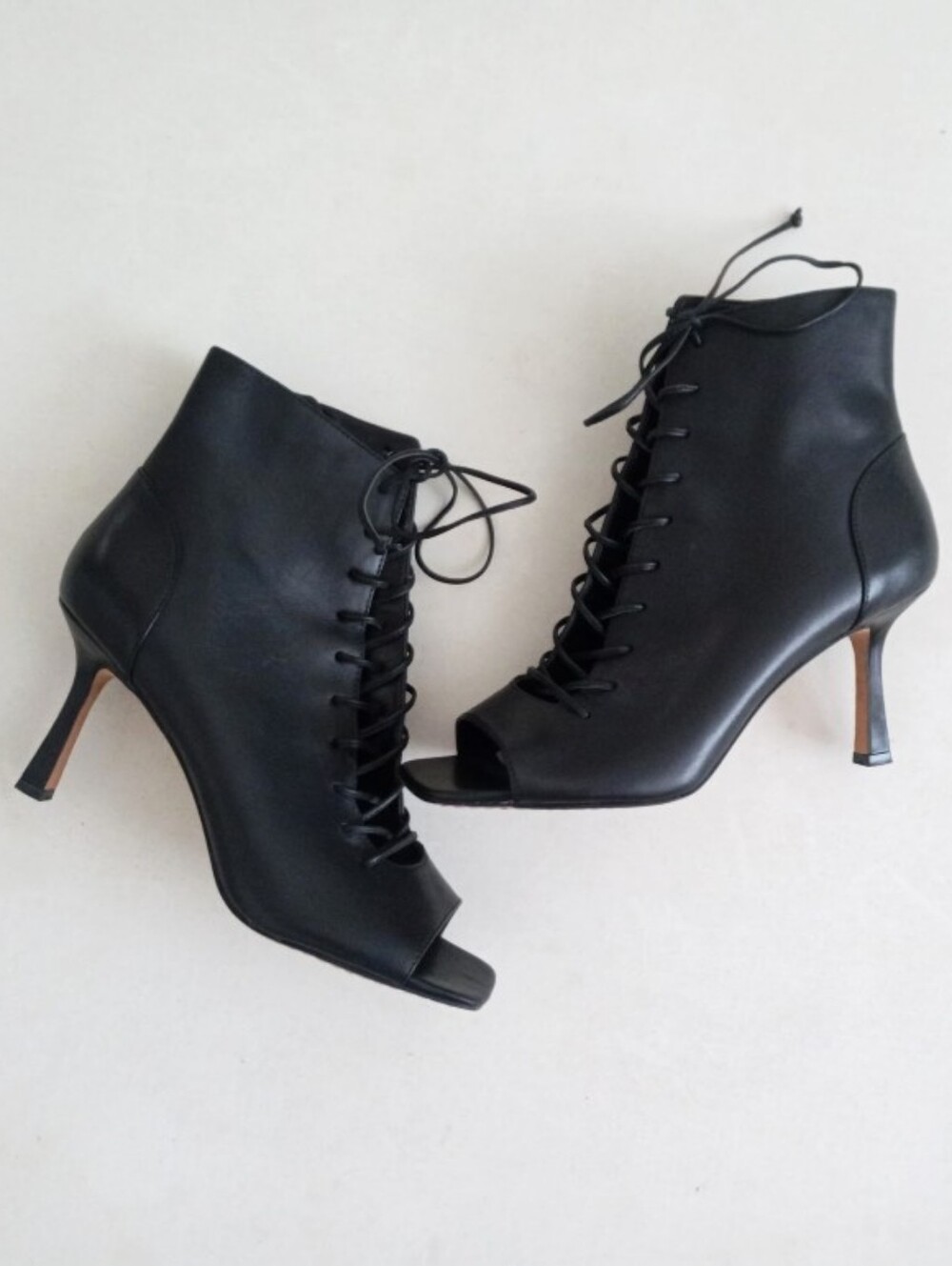 Vince Camuto black leather heeled lace up boots with a square open toe